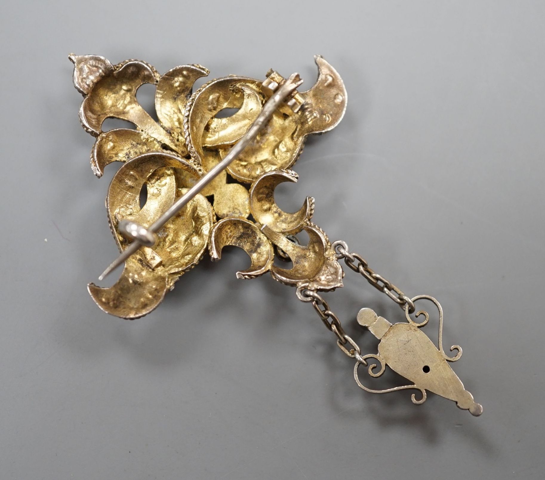 A 19th century Austro-Hungarian gilt white metal and semi-precious gem set drop brooch, 6cm.